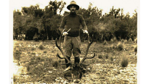John Deans with one of his early stags, taken during his 1919 season on Mount White Station.