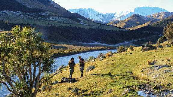 Informal discussion concerning flies or techniques on the bank of the Hurunui River. This kind of mutual mentoring is part of an enduring legacy.