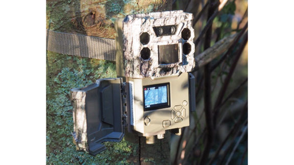 The Bushnell DS Core DS30MP trail cam in situ with the screen cover open.