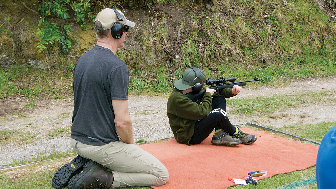 Supervising my youngest son, Luca, during our first shooting competition together.