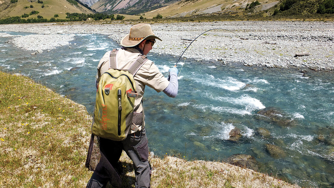 Simon Jones deals to a rainbow, which took his dry fly in Canterbury’s Avoca River.