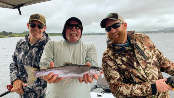 Phil, Dad and me with my dad’s first New Zealand rainbow trout.