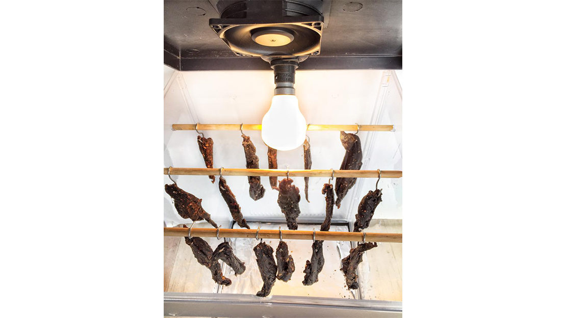 Biltong drying in Biltong drier with light and fan