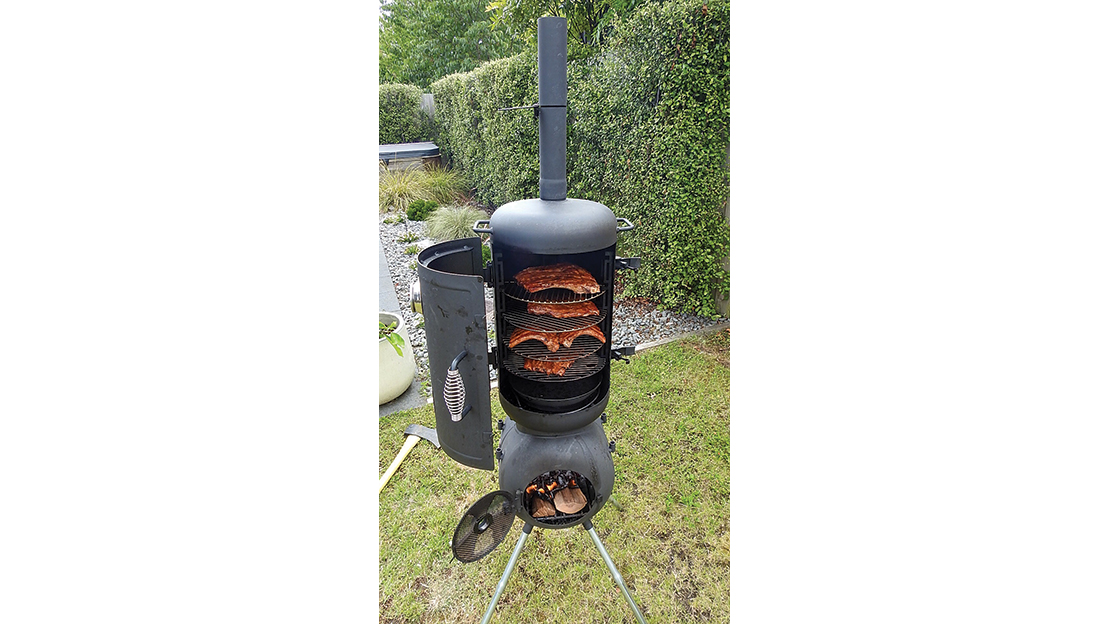 Starting to get the hang of the OZPig now with some super tasty pork spare ribs (note the placement of the smoking wood in the Pig’s belly on the edge of the coals).